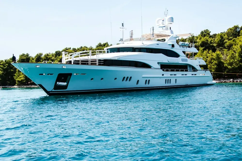 Private yacht on open water at golden hour