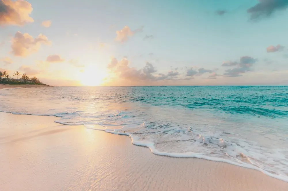 Turquoise lagoon meeting a quiet tropical beach