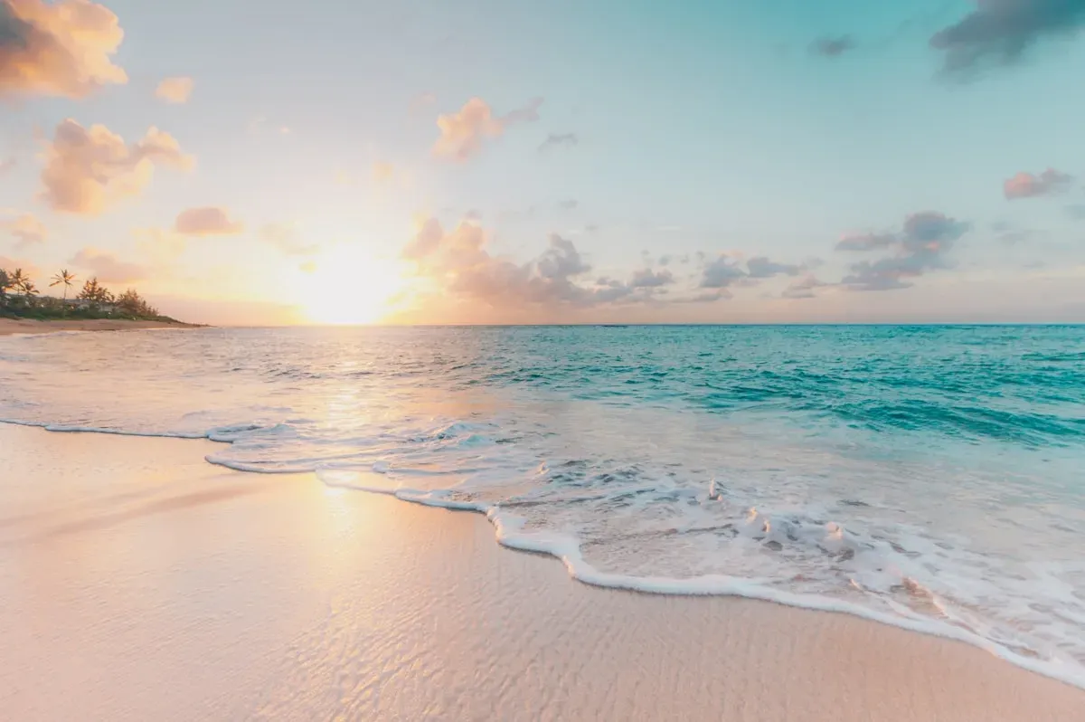 Turquoise tropical lagoon and white sand shoreline